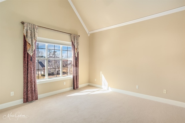 carpeted spare room featuring crown molding and lofted ceiling