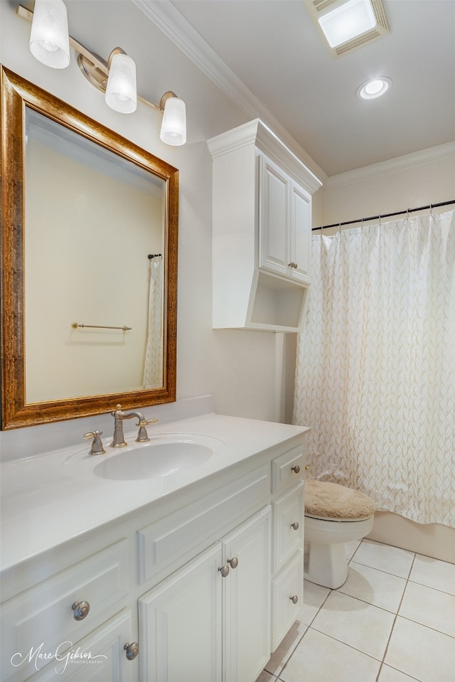 bathroom featuring toilet, tile patterned floors, crown molding, vanity, and curtained shower