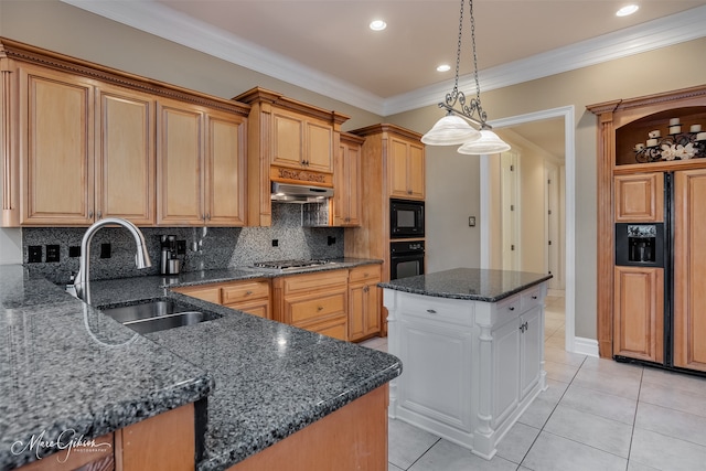 kitchen with black appliances, sink, dark stone countertops, and a center island