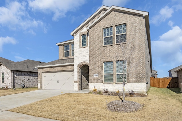 front facade featuring a garage and a front yard