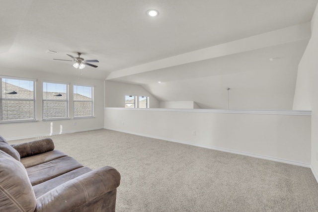 sitting room featuring ceiling fan, vaulted ceiling, and carpet floors