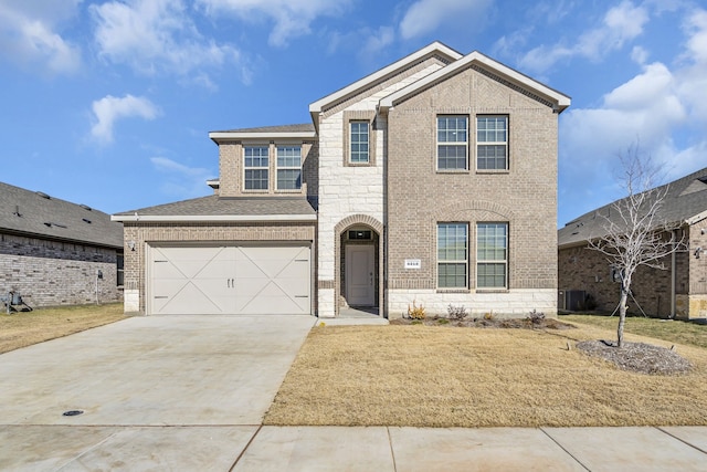 view of front property with a garage and a front yard