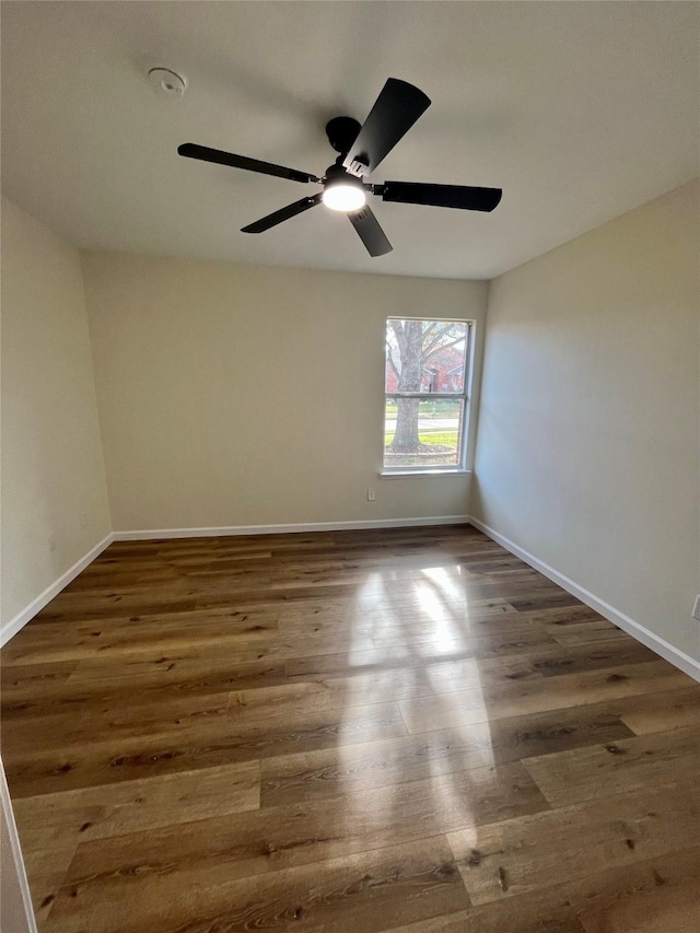 spare room featuring dark hardwood / wood-style floors