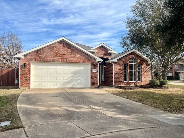 view of front of property with a garage and a front yard