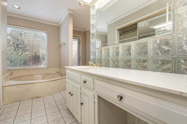 bathroom featuring tile patterned flooring, vanity, ornamental molding, a textured ceiling, and a bathing tub