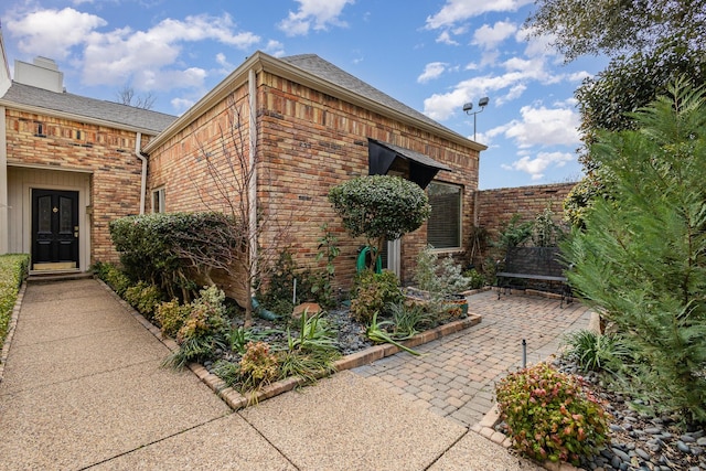 view of side of home featuring a patio