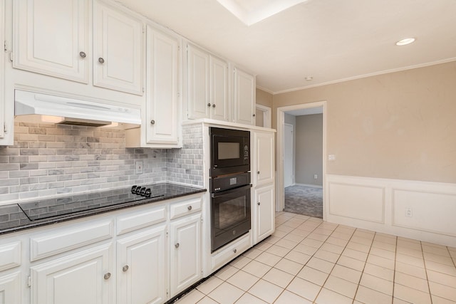 kitchen with white cabinetry, crown molding, light tile patterned floors, decorative backsplash, and black appliances