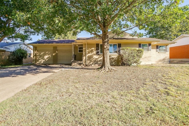 ranch-style house featuring a garage