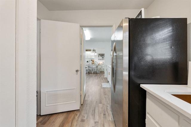 bathroom with hardwood / wood-style flooring and vanity