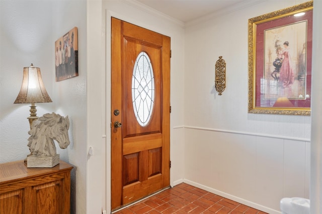 foyer featuring ornamental molding