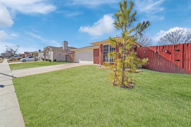 view of front facade with a garage and a front lawn