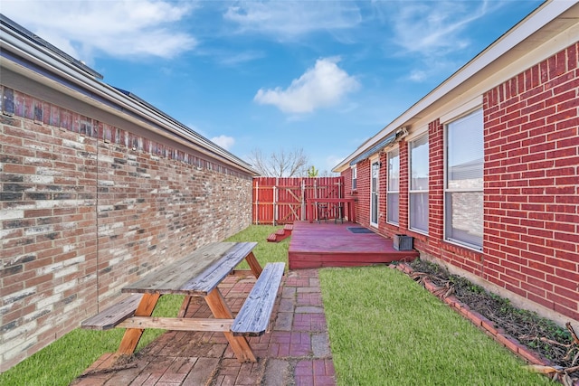 view of yard featuring a wooden deck