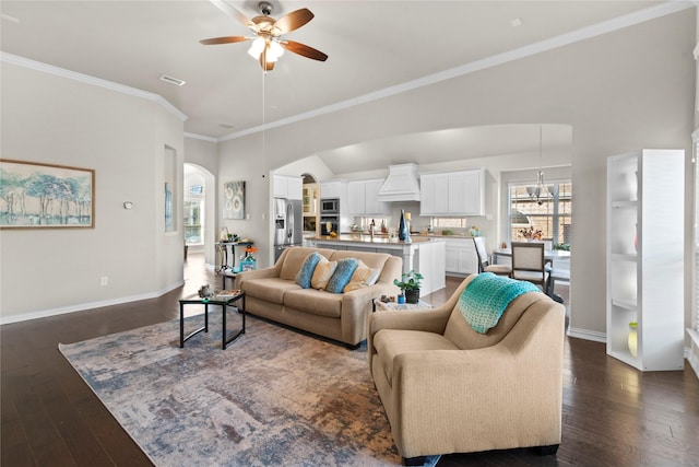 living room featuring ceiling fan, dark hardwood / wood-style flooring, and ornamental molding