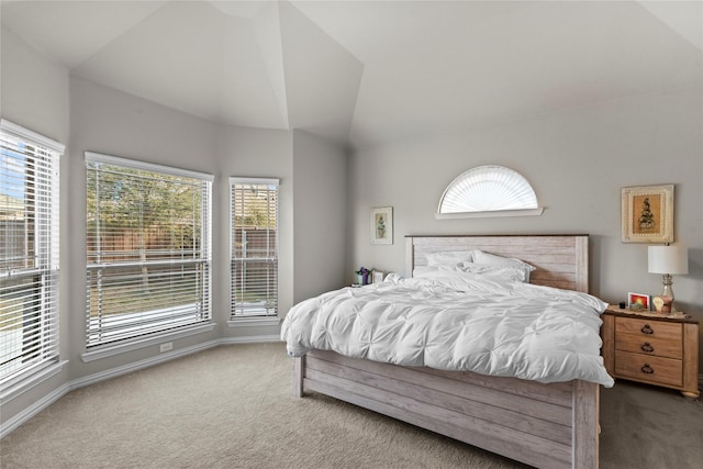 carpeted bedroom featuring vaulted ceiling