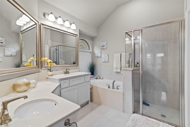 bathroom featuring tile patterned floors, vanity, lofted ceiling, and independent shower and bath