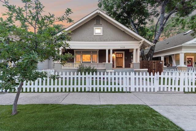 view of front of home featuring covered porch