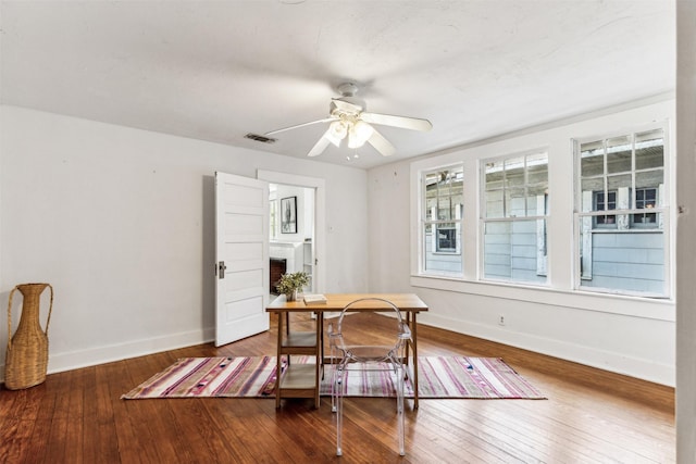 dining room featuring ceiling fan and hardwood / wood-style flooring