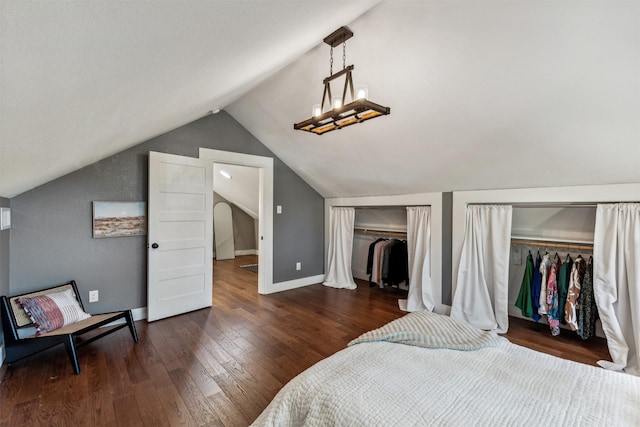 bedroom featuring dark hardwood / wood-style floors and lofted ceiling