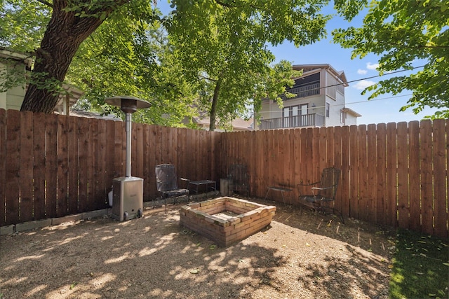 view of yard with a fire pit