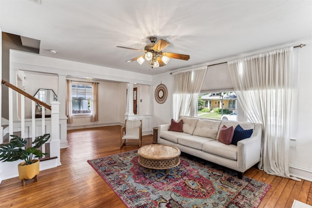 living room with ceiling fan and hardwood / wood-style floors