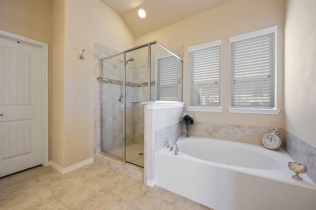 bathroom with vaulted ceiling, tile patterned floors, and plus walk in shower