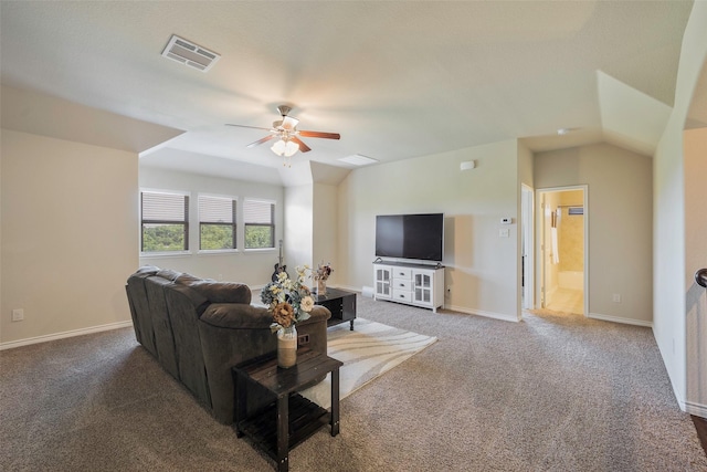 living room featuring ceiling fan, carpet, and lofted ceiling