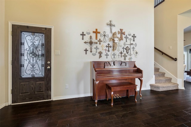 foyer entrance with dark hardwood / wood-style flooring