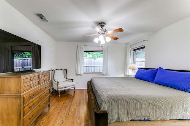 bedroom featuring ceiling fan and hardwood / wood-style flooring