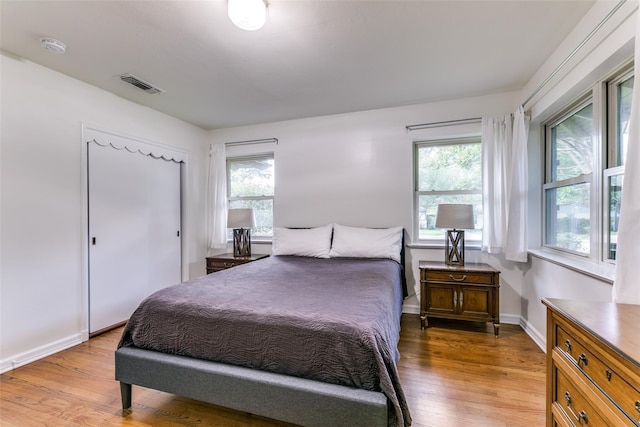 bedroom with light wood-type flooring