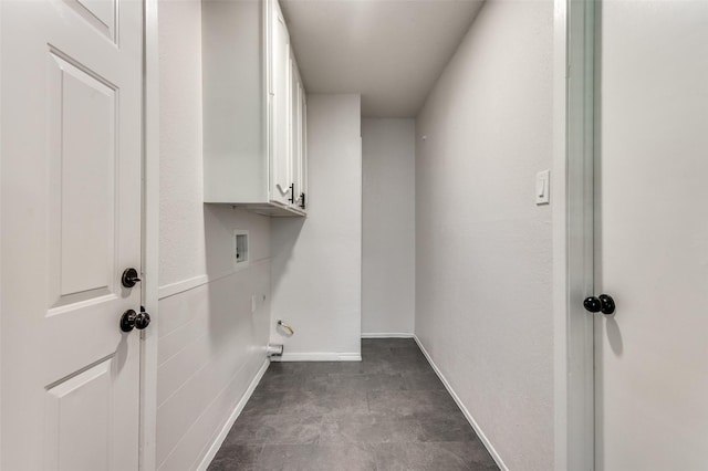 laundry room featuring washer hookup and cabinets