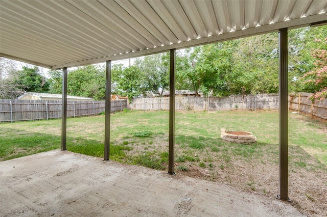 view of yard with a fire pit and a patio