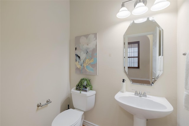 bathroom with sink and toilet