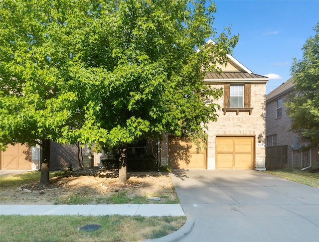 obstructed view of property featuring a garage