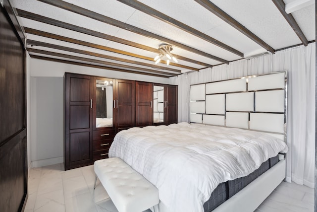 bedroom featuring beam ceiling