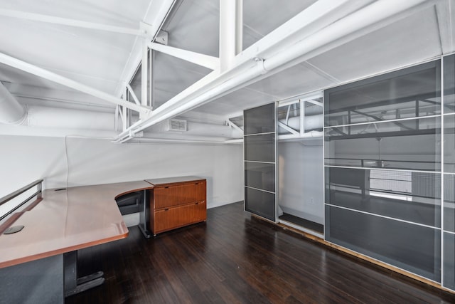 spacious closet with dark hardwood / wood-style floors