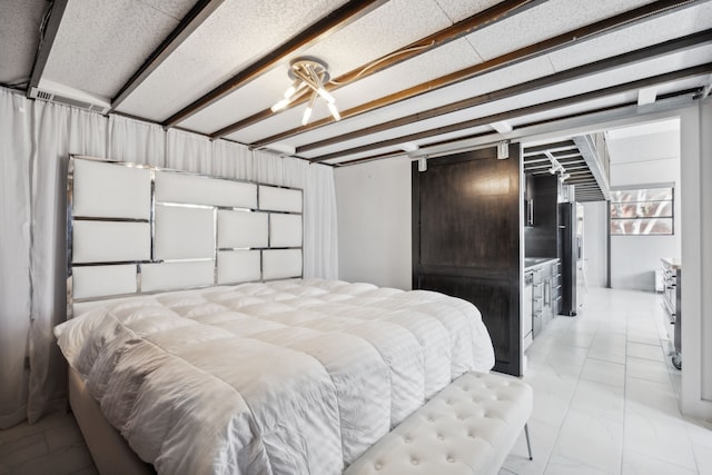 bedroom with a chandelier and beamed ceiling