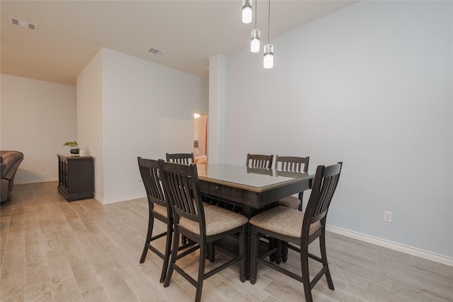 dining room with light wood-type flooring