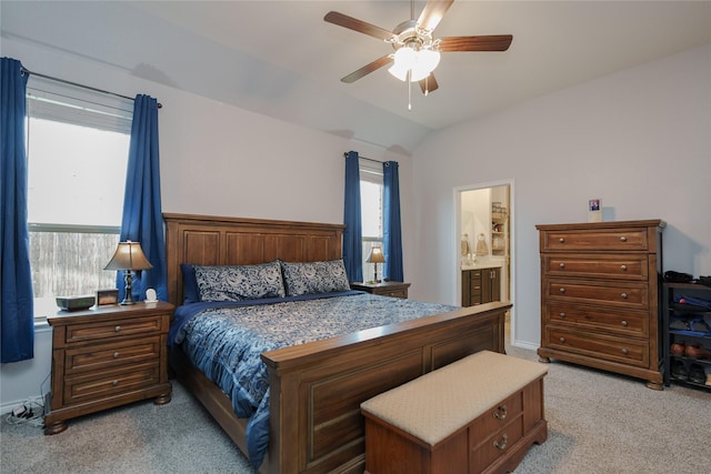 carpeted bedroom featuring ceiling fan, connected bathroom, and lofted ceiling