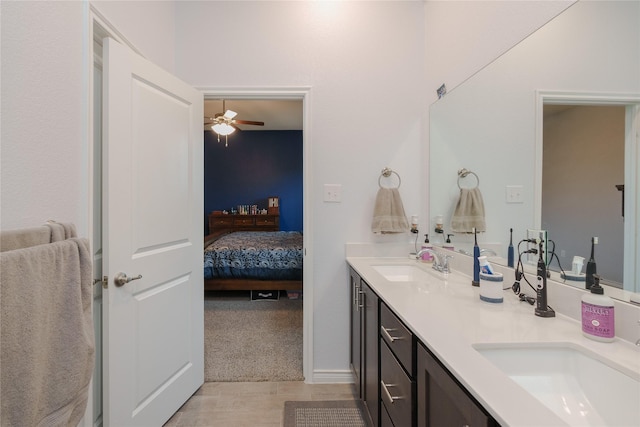 bathroom with ceiling fan and vanity