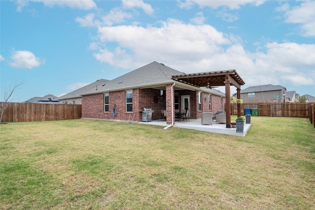 rear view of property featuring a patio area and a lawn