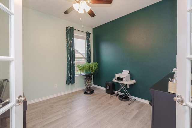 miscellaneous room featuring ceiling fan and light wood-type flooring