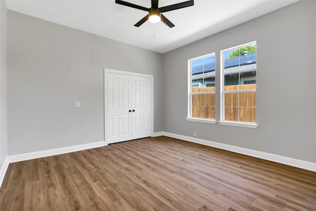 unfurnished room featuring ceiling fan and light hardwood / wood-style flooring