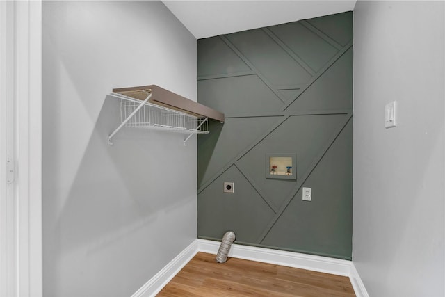 washroom with wood-type flooring, hookup for a washing machine, and electric dryer hookup