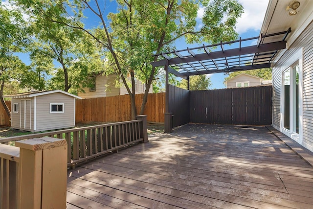 wooden terrace with a pergola and a shed