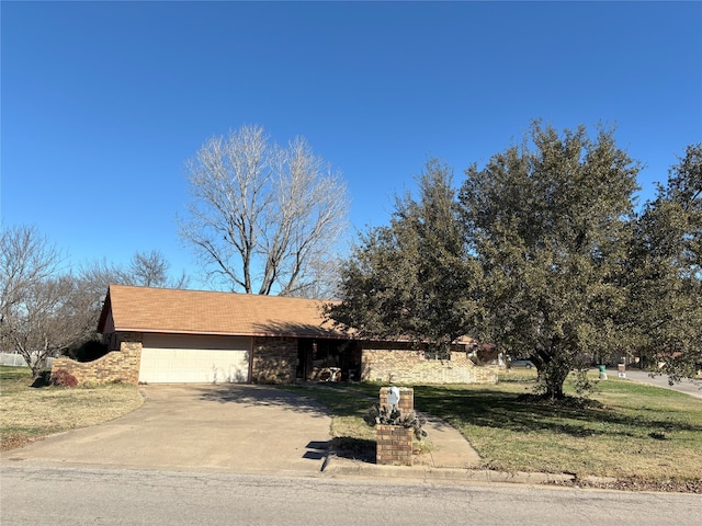 view of front facade with a front lawn and a garage