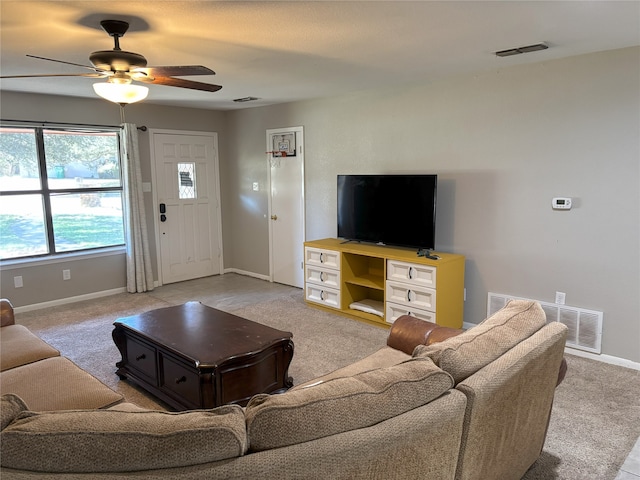 living room with ceiling fan and light colored carpet