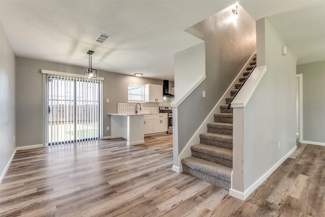 interior space featuring hardwood / wood-style flooring and sink