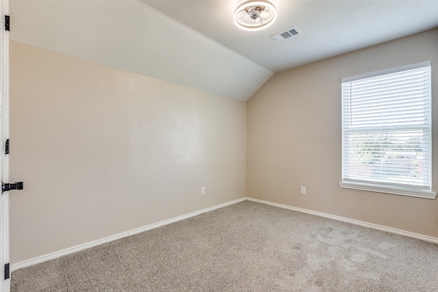 bonus room with lofted ceiling and carpet floors