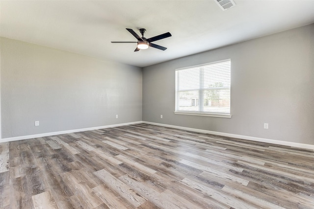 spare room with ceiling fan and light hardwood / wood-style flooring