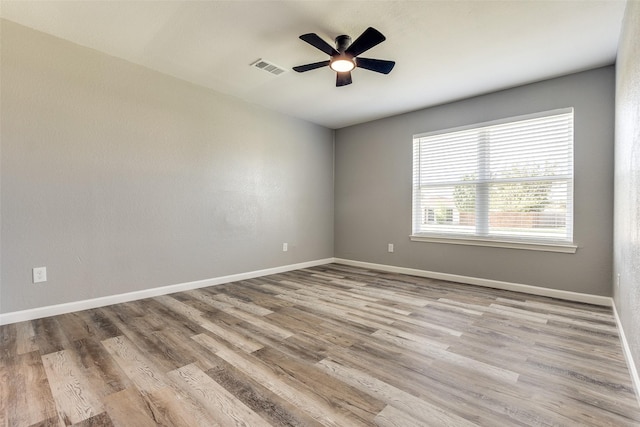 unfurnished room with ceiling fan and light hardwood / wood-style floors